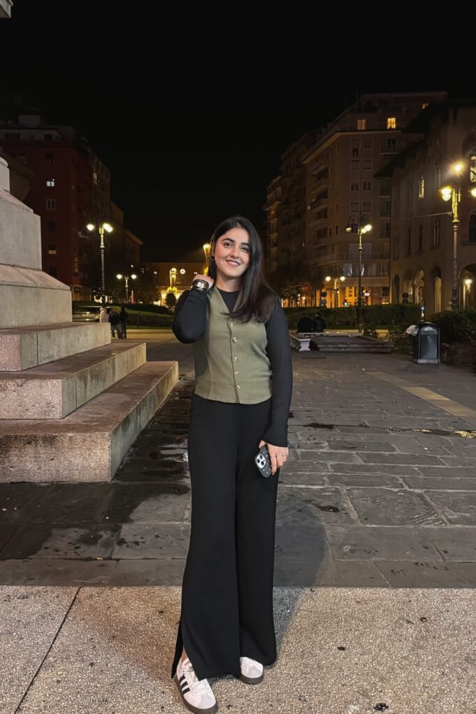 Olive Green Waistcoat + Black Long Sleeve Top + Black Wide Leg Trousers + White Sneakers