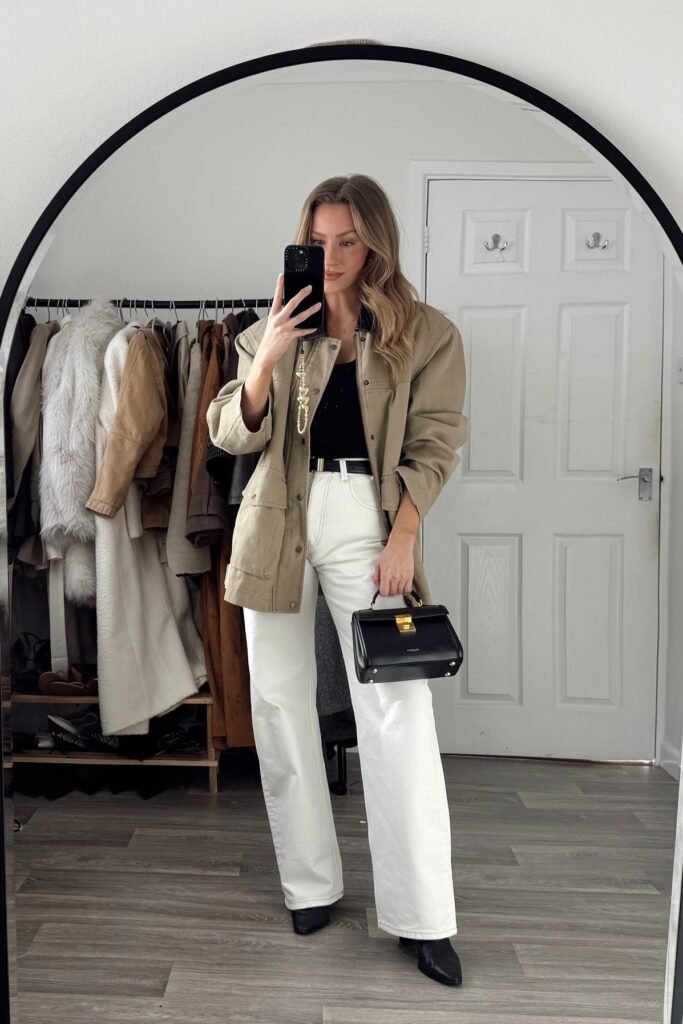 Olive Utility Jacket + Black Bodysuit + White Wide-Leg Jeans + Black Pointed Boots