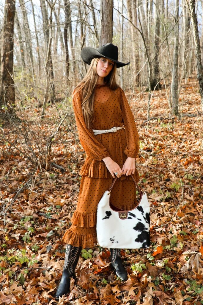 Orange Polka Dot Tiered Maxi Dress + Black Patterned Western Boots + Cow-Print Tote Bag
