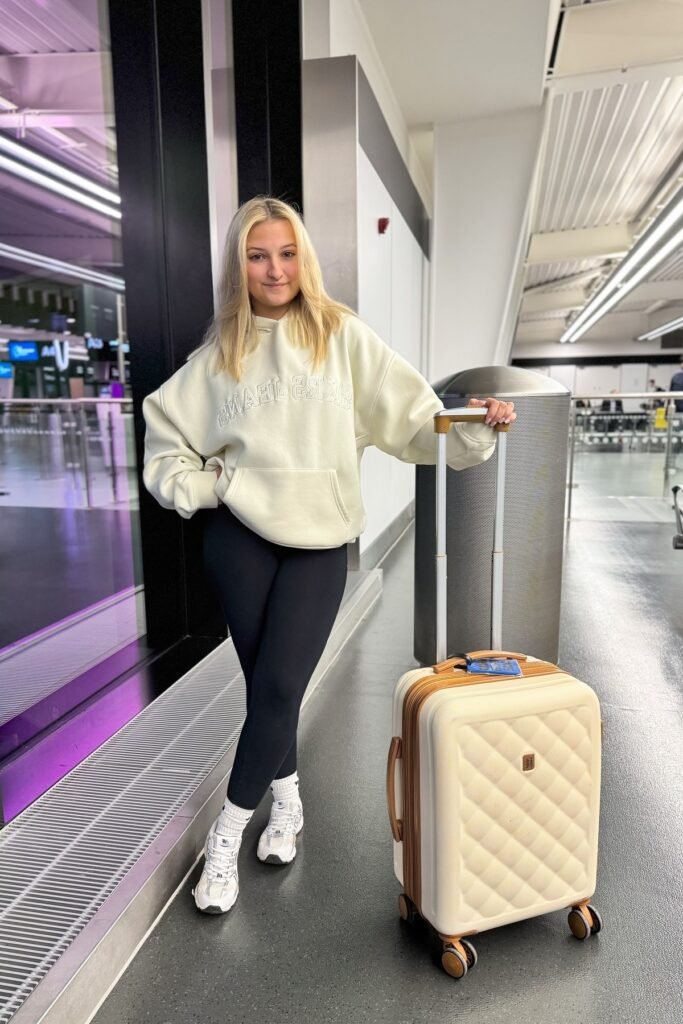 Oversized Cream Hoodie + Black Leggings + White Athletic Sneakers