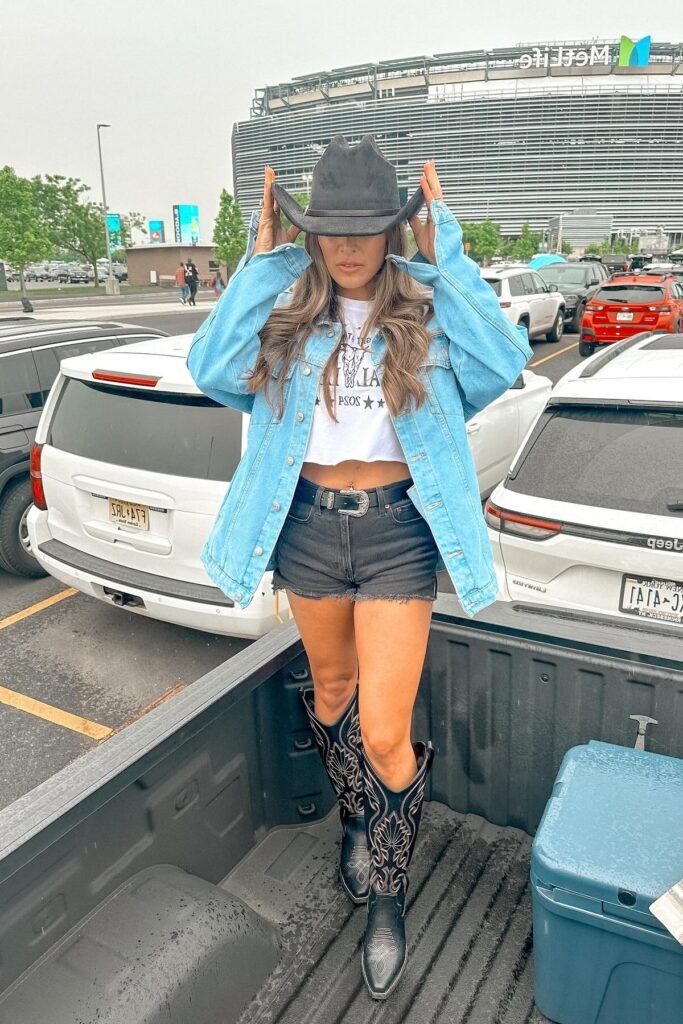 Oversized Denim Jacket + White Crop Top + Black Denim Cut-offs + Black Embroidered Cowboy Boots + Black Cowboy Hat