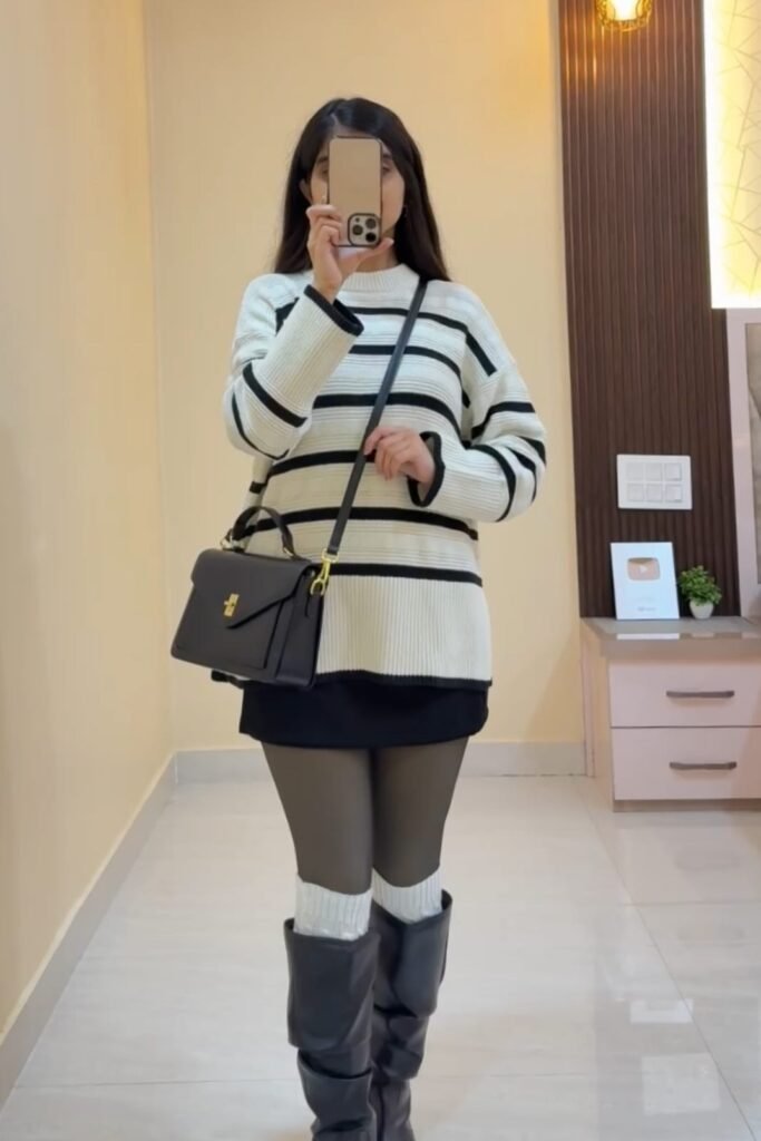 Oversized Striped Sweater + Black Mini Skirt + Sheer Tights + Black Knee-High Boots with White Leg Warmers