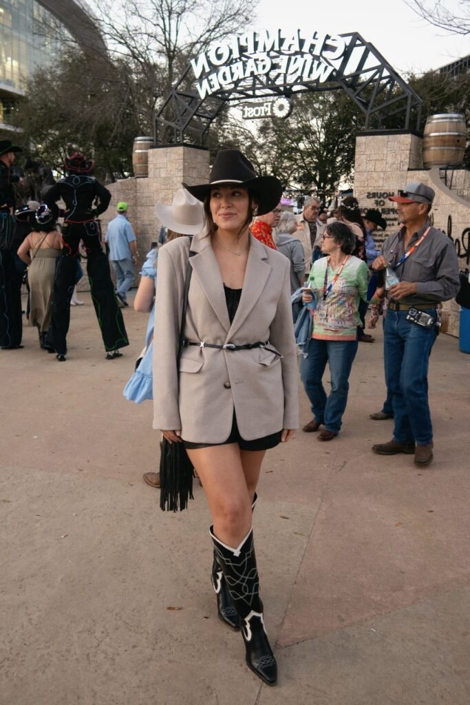 Oversized Taupe Blazer + Black Mini Dress + Black and White Western Boots + Black Cowboy Hat