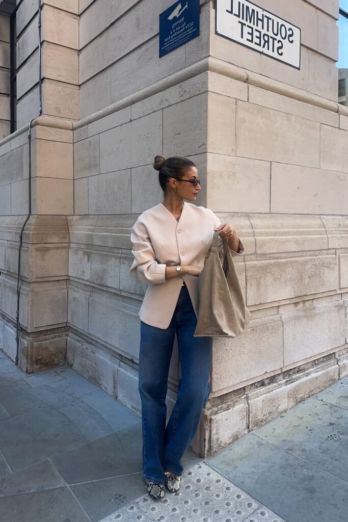 Pale Pink Structured Collarless Jacket + Medium Wash Straight-Leg Jeans + Snakeskin Print Boots
