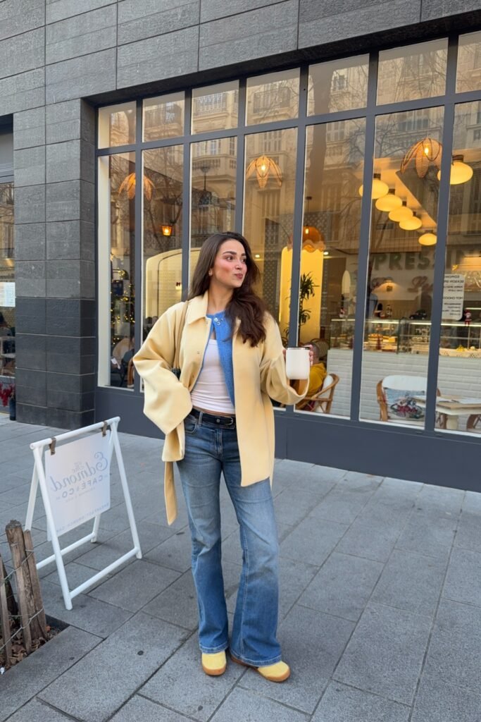 Pale Yellow Oversized Coat + Blue Cardigan + Flared Jeans + Yellow Shoes