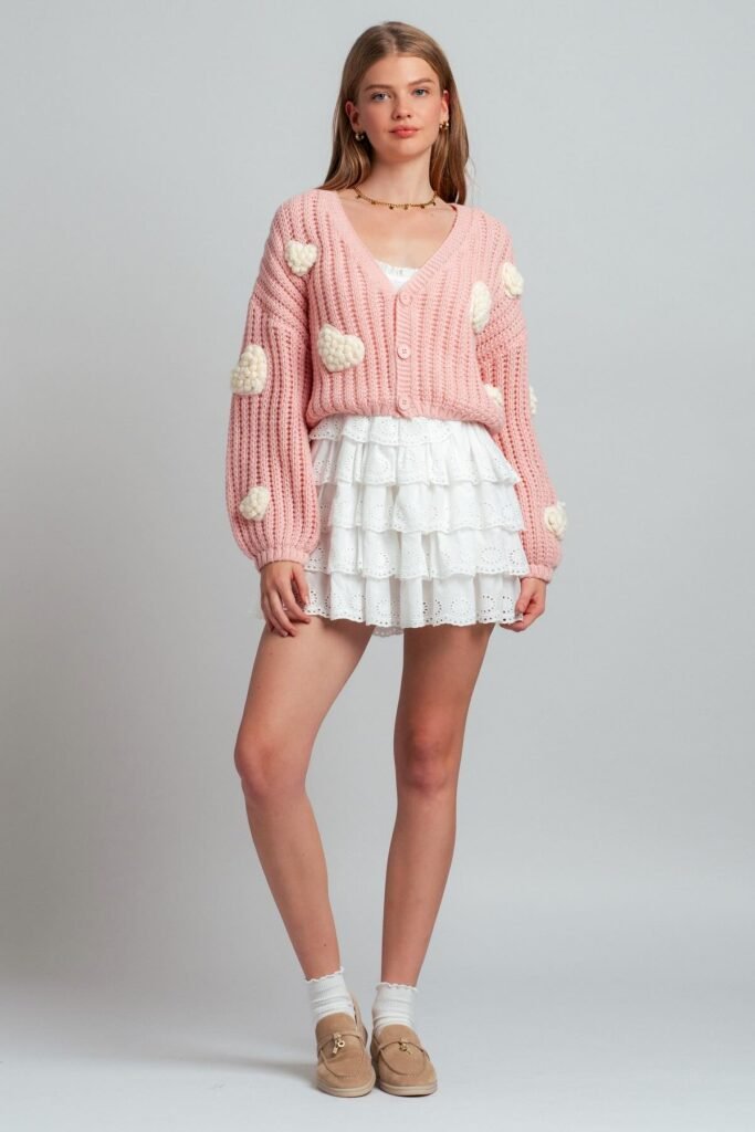 Pink Chunky Knit Cardigan with Heart Details + White Ruffled Eyelet Mini Skirt + Tan Suede Loafers + White Ruffled Socks