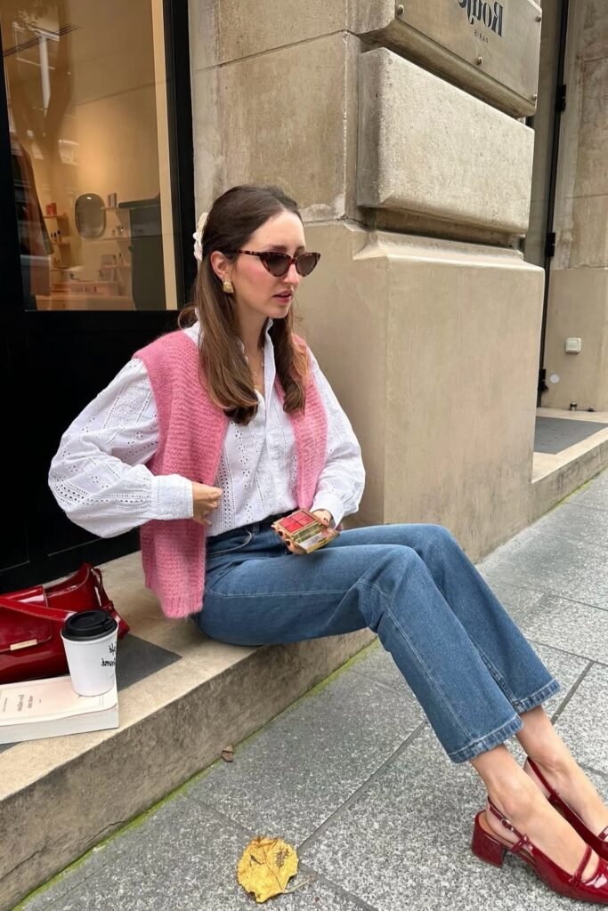 Pink Knitted Vest + White Eyelet Blouse + Straight-Leg Blue Jeans + Red Mary Janes