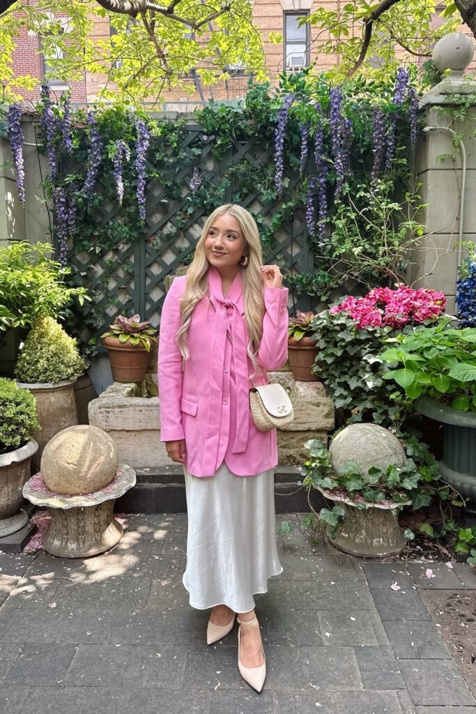 Pink Oversized Blazer with Bow Detail + White Satin Midi Skirt + Nude Pointed Toe Heels + Straw Crossbody Bag
