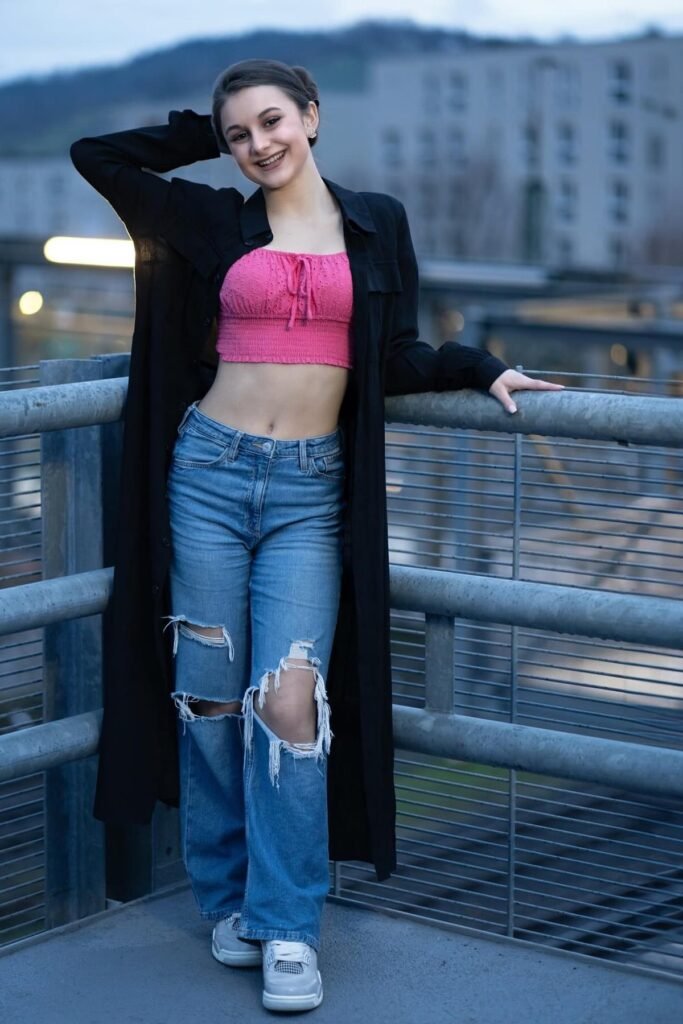 Pink Smocked Crop Top + Distressed Light Wash Jeans + Long Black Button-Up Shirt