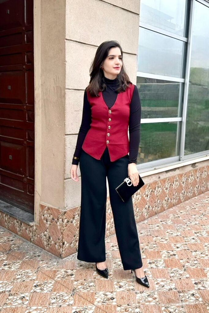 Red Button-Up Vest + Black Long-Sleeve Turtleneck + Black Wide-Leg Trousers + Black Patent Pumps