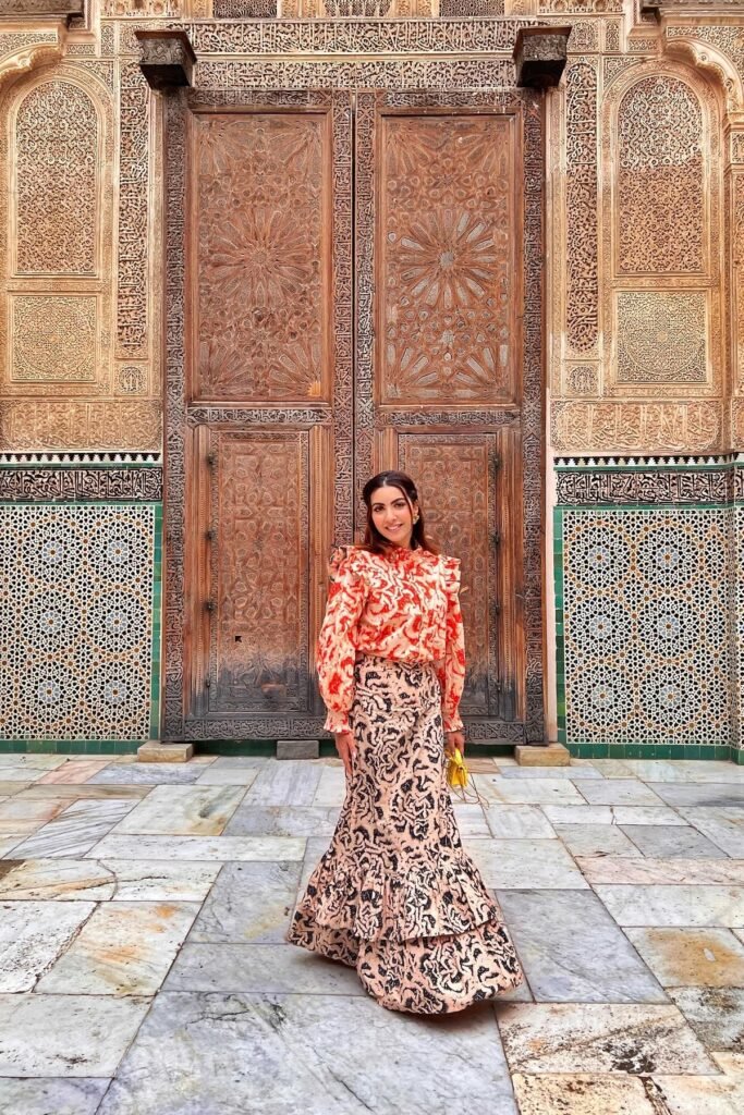 Red and Orange Ruffled Floral Blouse + Patterned Tiered Maxi Skirt + Yellow Micro Bag