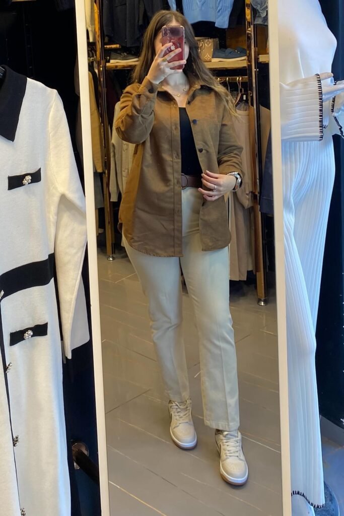 Tan Suede Button-Down Shirt + Black Camisole + Beige Chino Pants + Cream Sneakers