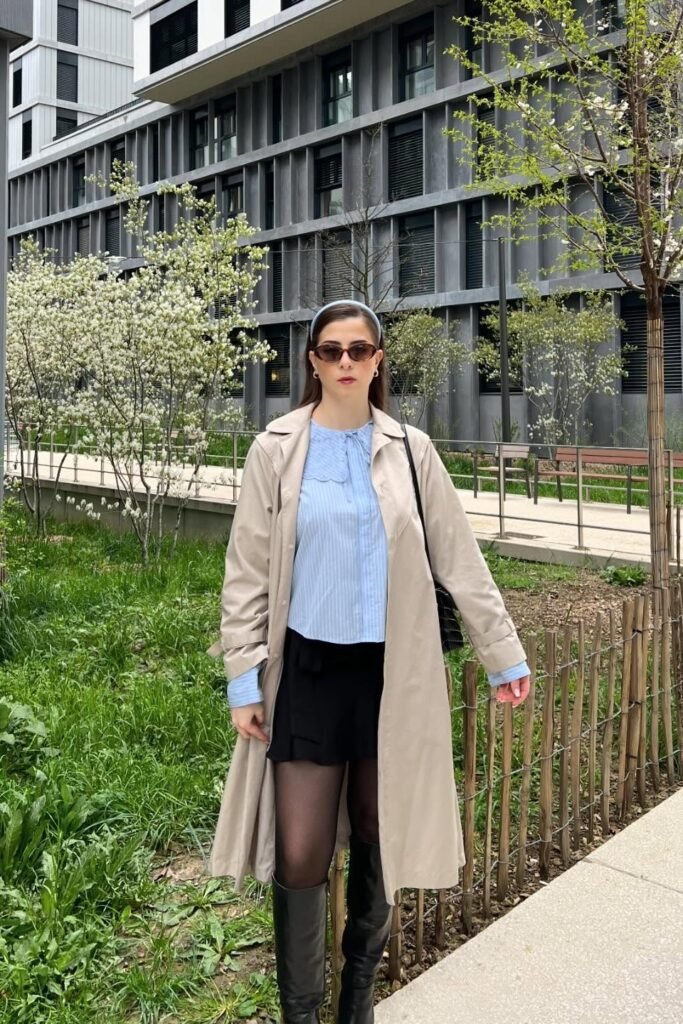 Tan Trench Coat + Light Blue Striped Button Down + Black Mini Skirt + Black Leather Knee High Boots