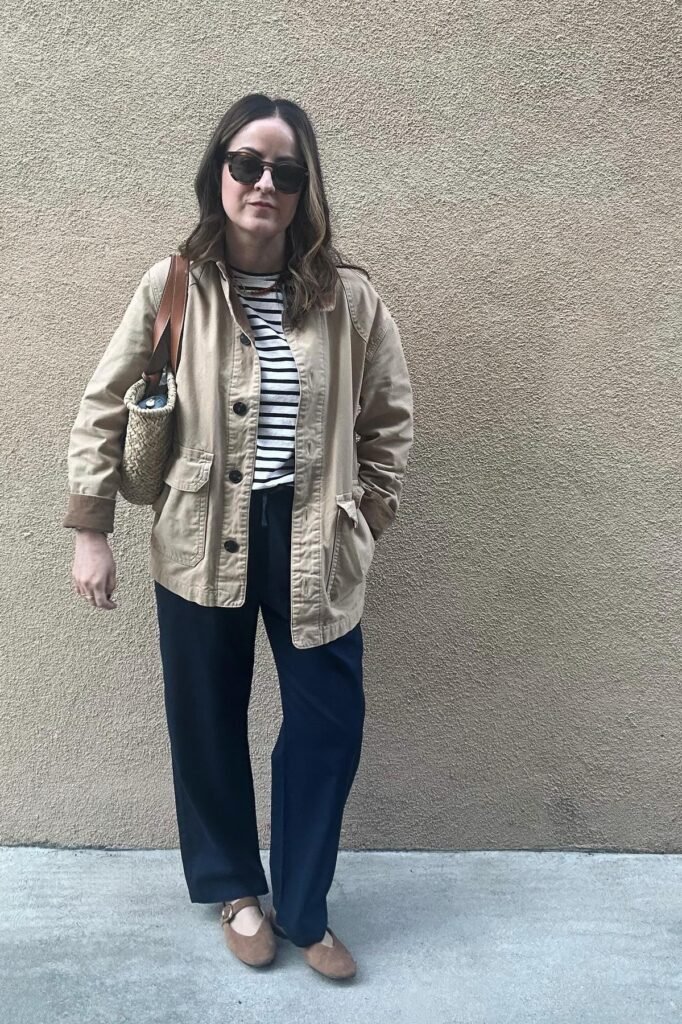 Tan Utility Jacket + Black and White Striped Tee + Navy Wide-Leg Trousers + Tan Mary Jane Flats