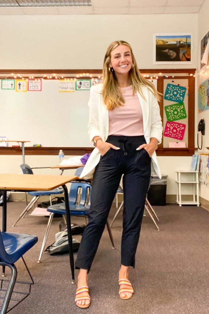 White Blazer + Pink Tee + Black Jogger Trousers + Multi-Color Striped Sandals