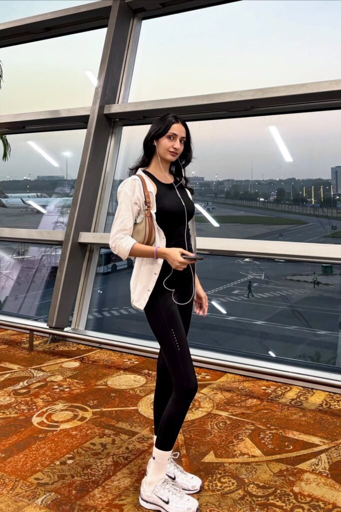 White Button-Down Shirt + Black Athletic Bodysuit + Black Leggings + White Nike Sneakers