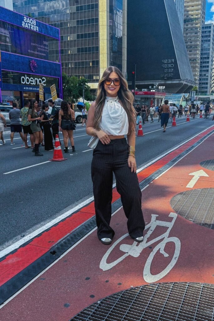 White Halter Crop Top + Black Pinstripe Wide-Leg Trousers + White Sneakers