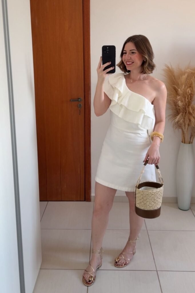 White One-Shoulder Ruffle Mini Dress + Gold Strappy Sandals + Straw Bucket Bag