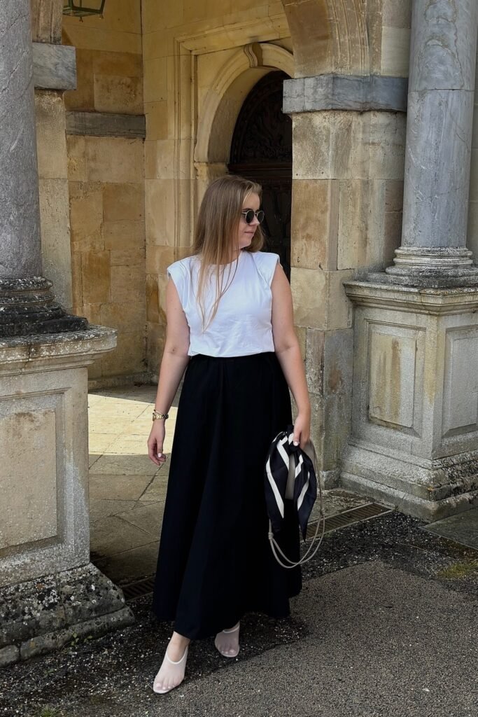 White Padded-Shoulder Tee + Black Maxi Skirt + White Mesh Ballet Flats