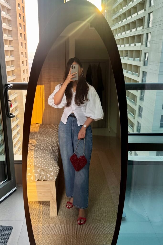 White Puff Sleeve Blouse + Wide Leg Blue Jeans + Red Sandals + Red Heart Bag
