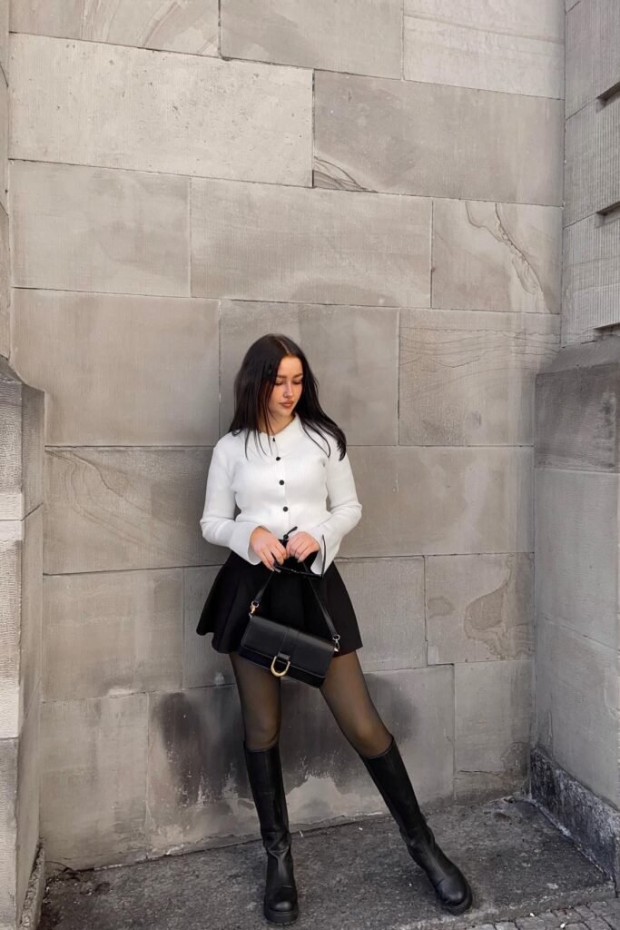 White Ribbed Button Up Cardigan + Black Mini Skater Skirt + Sheer Black Tights + Black Knee High Boots