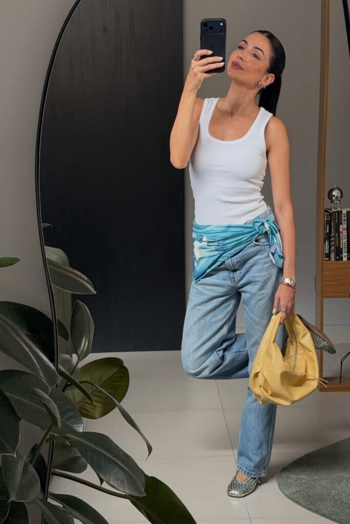 White Ribbed Tank Top + Light Wash Straight-Leg Jeans + Blue Printed Scarf Belt + Yellow Hobo Bag + Studded Silver Flats