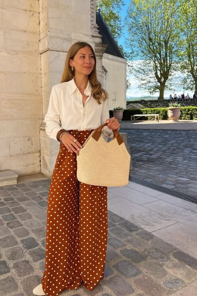 White Silk Button-Down + Rust Polka Dot Wide-Leg Trousers + Straw Tote Bag
