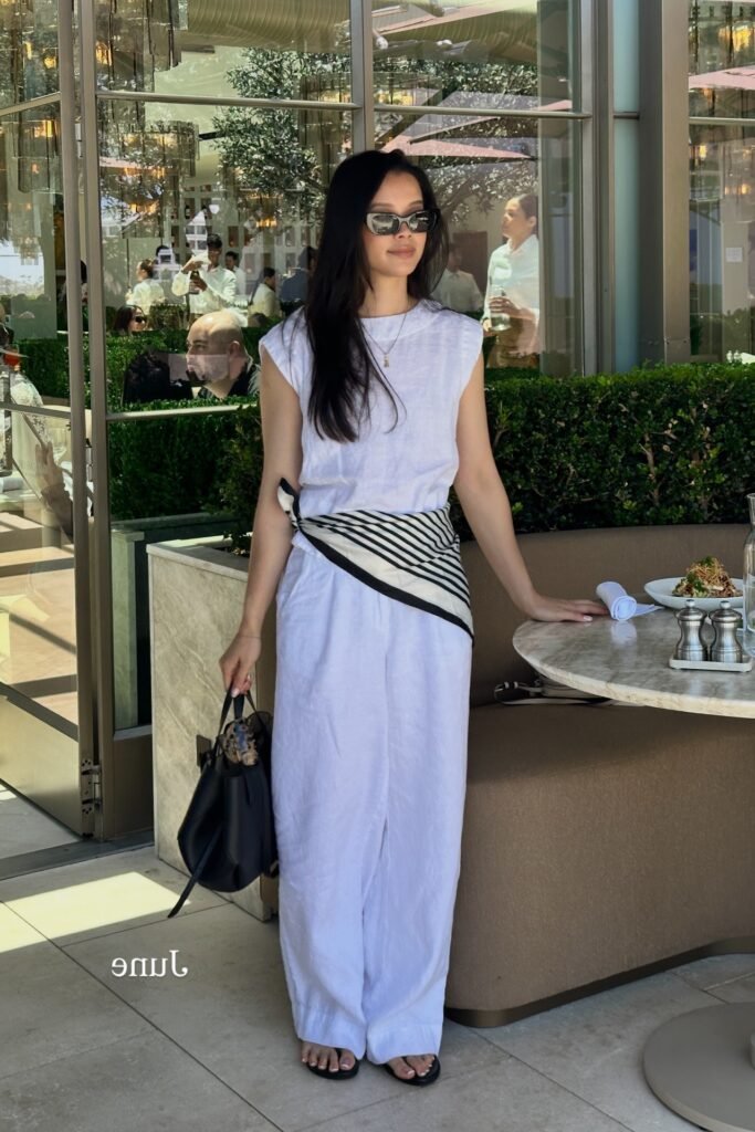 White Sleeveless Linen Top + Striped Waist Scarf + White Wide-Leg Linen Trousers + Black Strappy Sandals