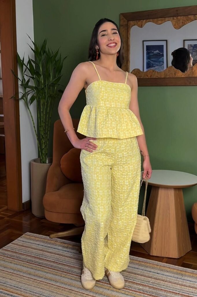 Yellow Floral Peplum Top + Matching Wide-Leg Trousers + Beige Sneakers
