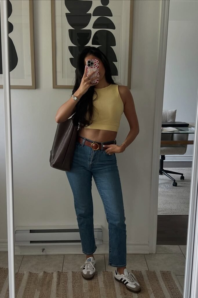 Yellow Ribbed Crop Top + Blue Jeans + Brown Leather Belt + White Sneakers