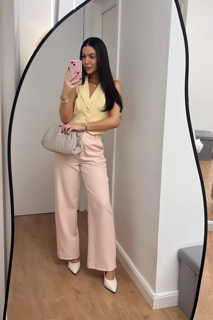 Yellow Sleeveless Waistcoat + Pastel Pink Wide-Leg Trousers + White Pointed Heels