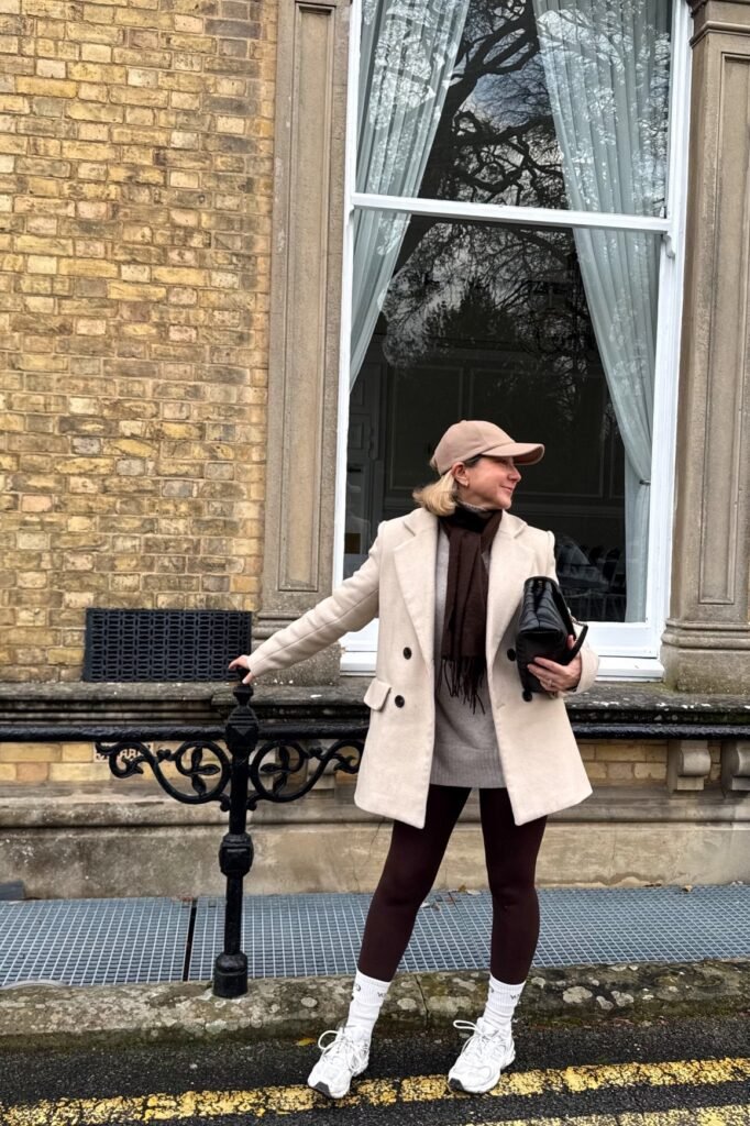Beige Double-Breasted Coat + Grey Turtleneck + Dark Brown Leggings + White Sneakers