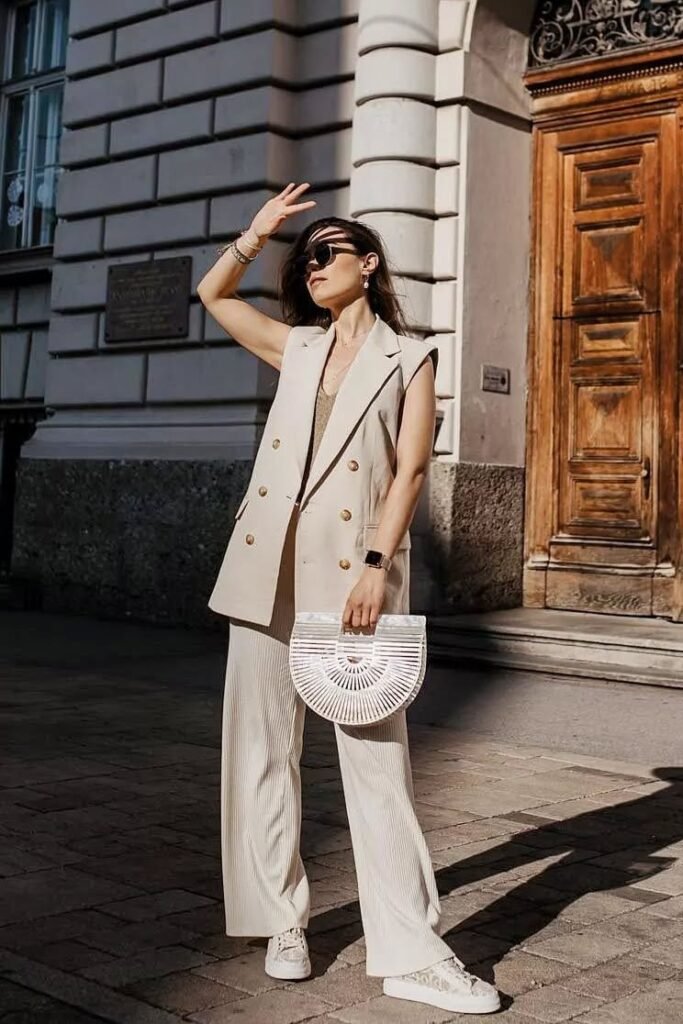 Beige Double-Breasted Long Vest + Matching Beige Wide-Leg Trousers + White Patterned Sneakers