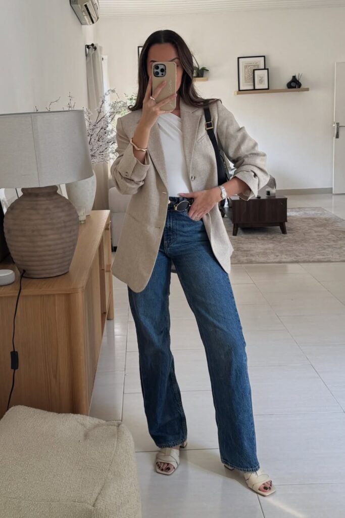 Beige Oversized Blazer + White Asymmetrical Top + Medium Wash Wide-Leg Jeans + Cream Square-Toe Sandals