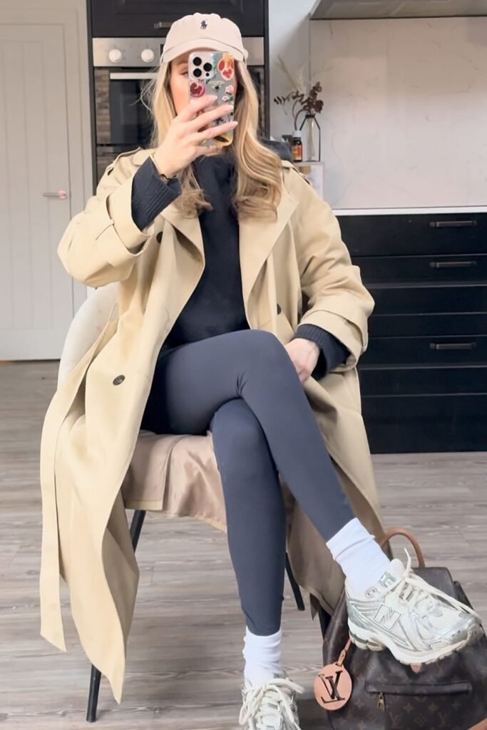 Beige Trench Coat + Black Knit Sweater + Dark Grey Leggings + Silver Sneakers with White Crew Socks
