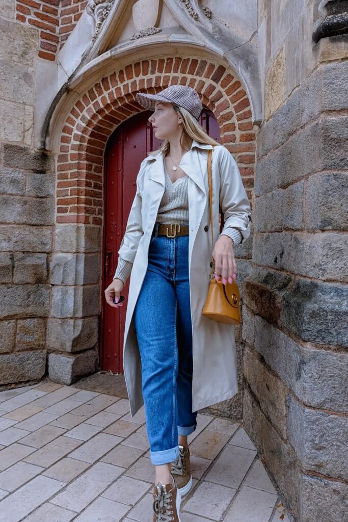 Beige Trench Coat + Grey Ribbed V-Neck Sweater + Blue Mom Jeans + Brown Platform Sneakers