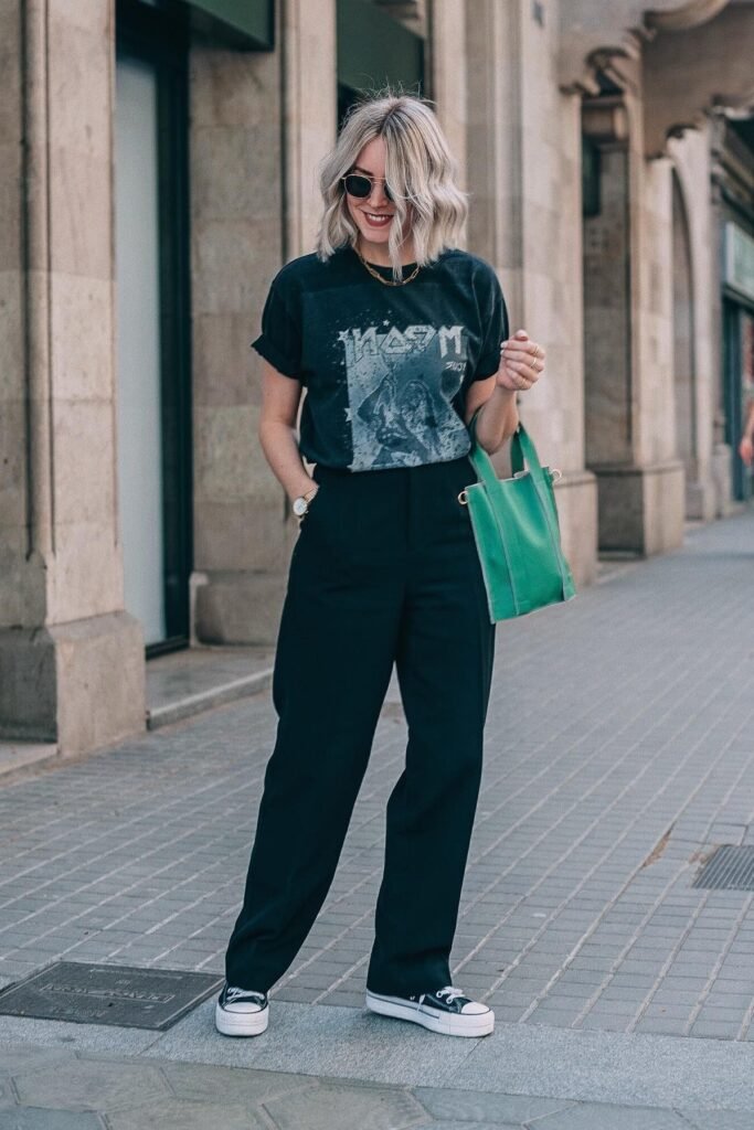 Black Band Graphic T-Shirt + Black Wide-Leg Trousers + Green Mini Tote Bag + Black and White Canvas Sneakers