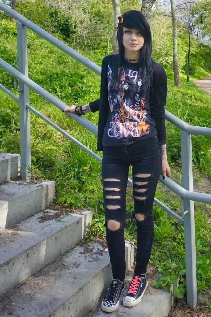 Black Band T-Shirt + Black Ripped Skinny Jeans + Black Cardigan + Mismatched Laced Sneakers