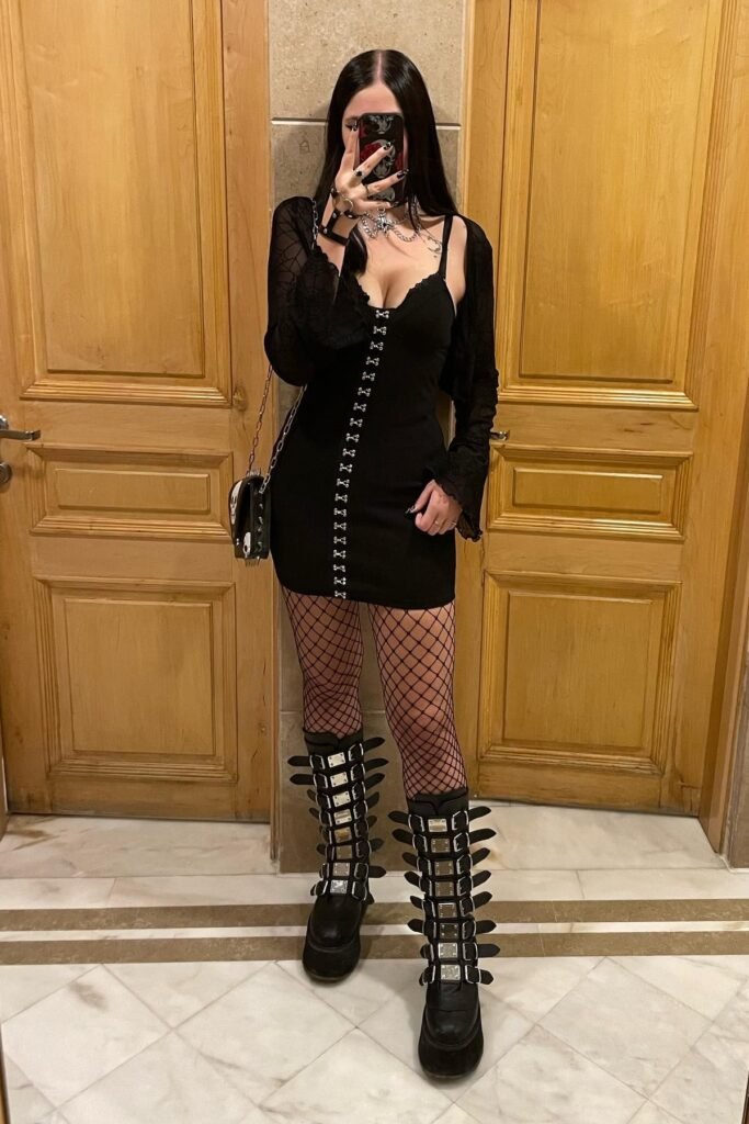 Black Bodycon Dress with Metal Clasps + Mesh Shrug + Fishnet Tights + Multi-strap Platform Boots