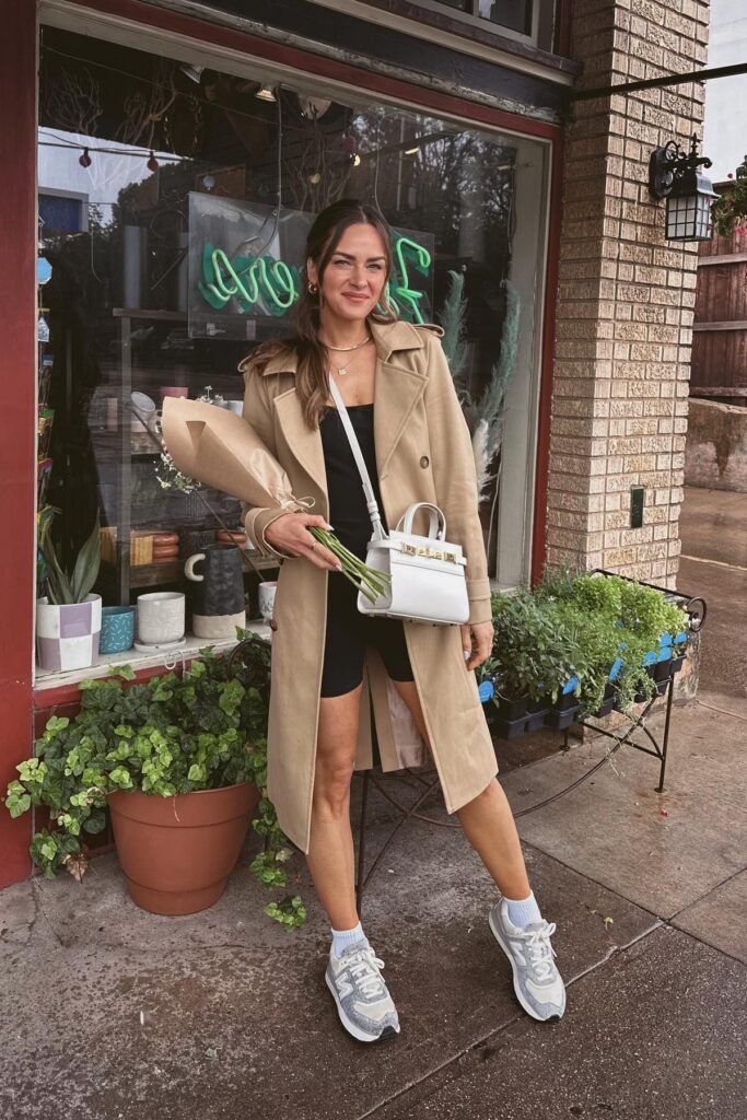 Black Bodycon Romper + Tan Mid-Length Trench Coat + Grey and White Athletic Sneakers