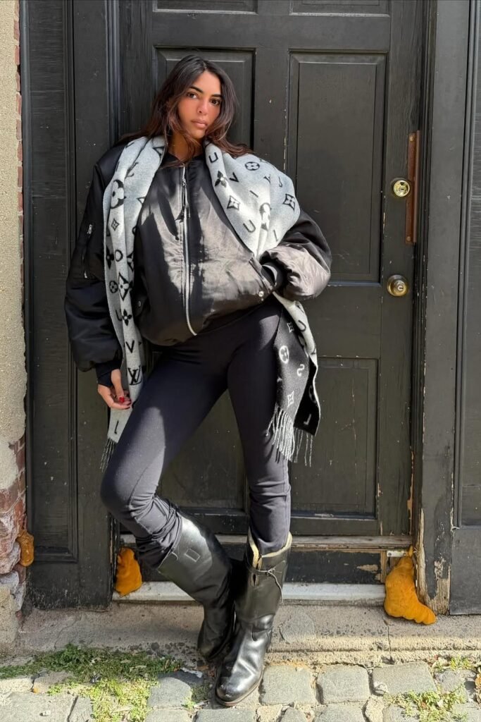 Black Bomber Jacket + Monogrammed Grey Scarf + Grey Leggings + Black Mid-Calf Boots