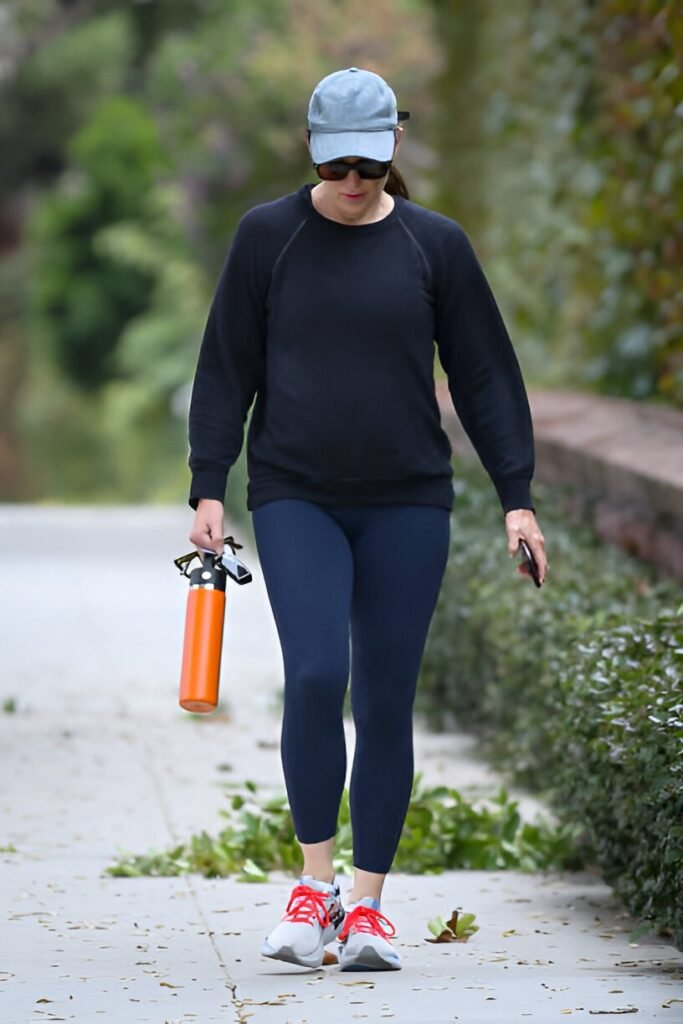 Black Crewneck Sweatshirt + Navy Leggings + White and Red Sneakers
