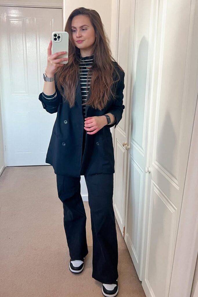 Black Double-Breasted Blazer + Striped Turtleneck + Black Wide-Leg Trousers + Black and White Sneakers