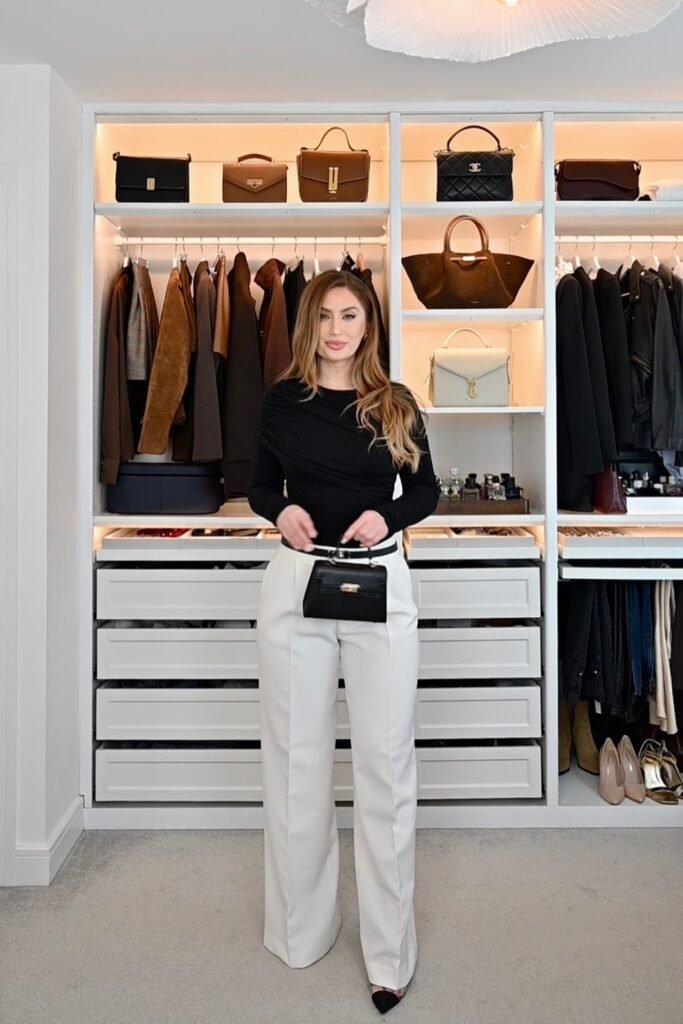 Black Draped Long-Sleeve Top + White Wide-Leg Trousers + Small Black Handbag + Black Pointed-Toe Heels