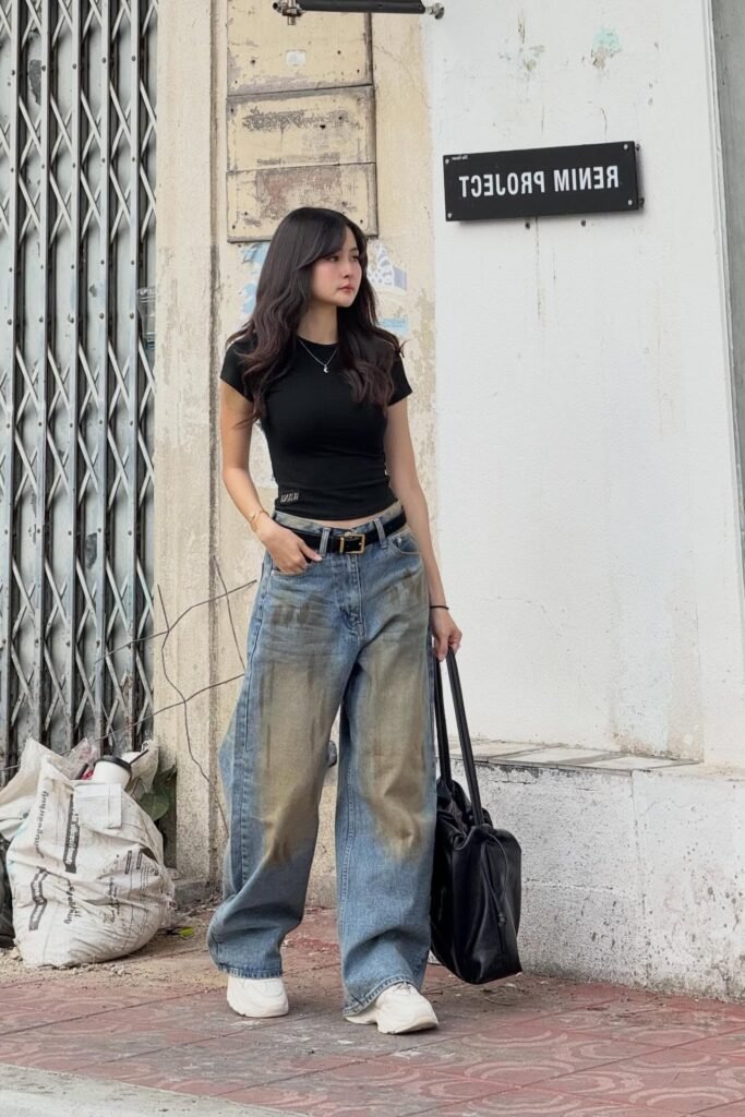 Black Fitted T-Shirt + Distressed Wide-Leg Jeans + White Chunky Sneakers