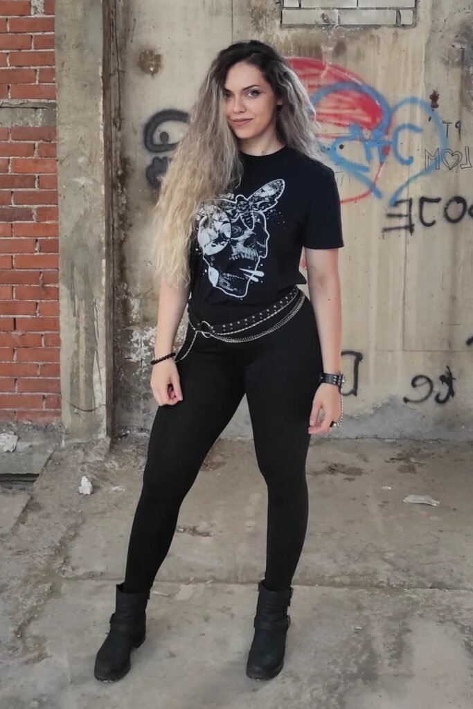 Black Graphic T-Shirt + Black High-Waisted Leggings + Studded Chain Belt + Black Ankle Boots