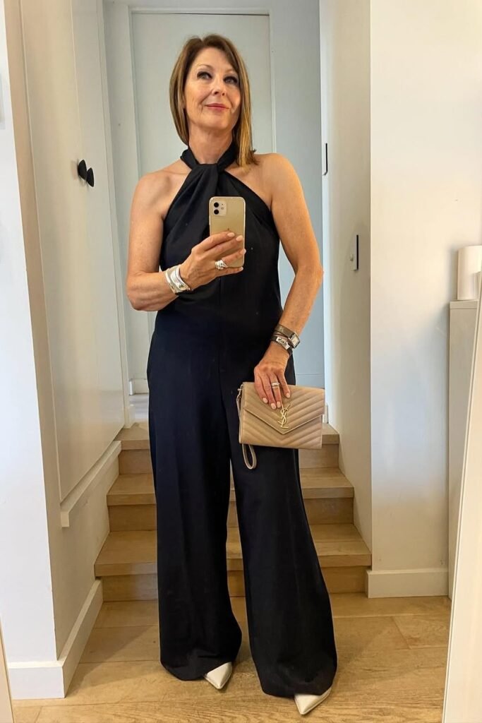 Black Halter-Neck Jumpsuit + Beige Pointed-Toe Heels + Beige Quilted Clutch