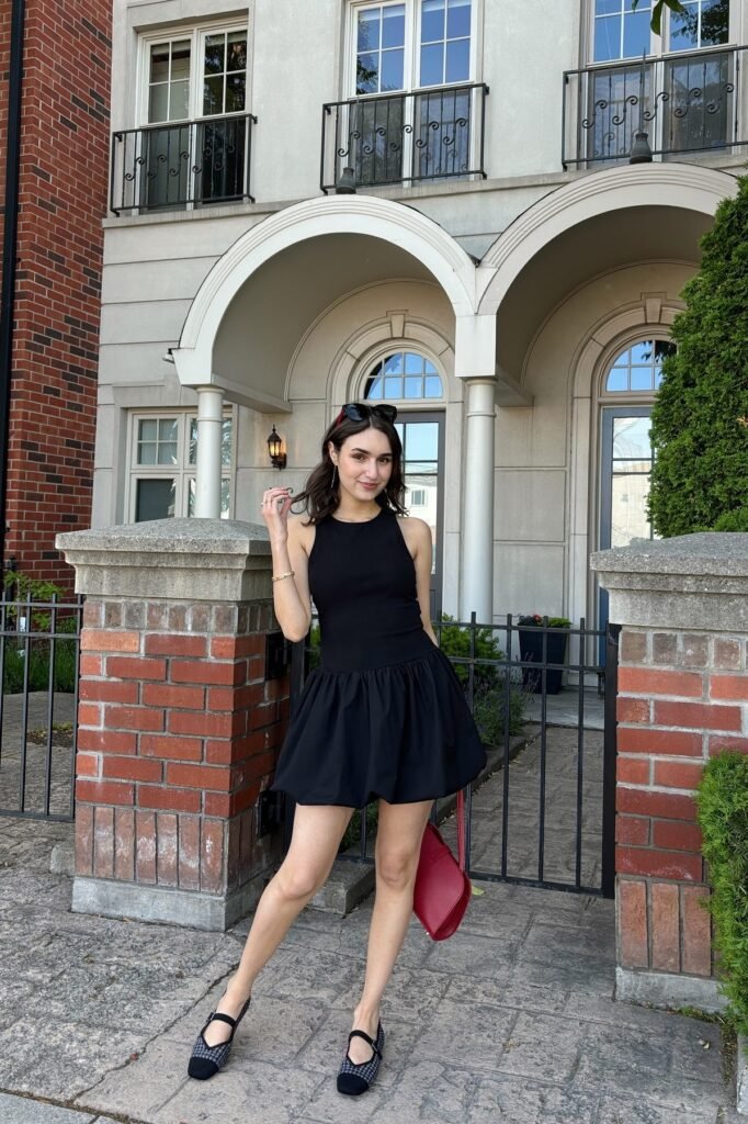 Black High-Neck Drop-Waist Mini Dress + Plaid Mary Jane Flats + Red Shoulder Bag