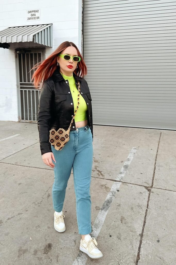 Black Leather Jacket + Neon Lime Crop Top + Light Wash Jeans + Off-White Sneakers
