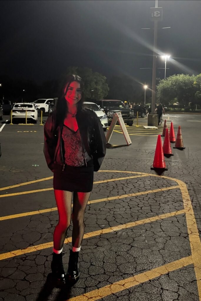 Black Leather Jacket & Snake Print Top + Black Mini Skirt + Fishnet Tights & Black Combat Boots